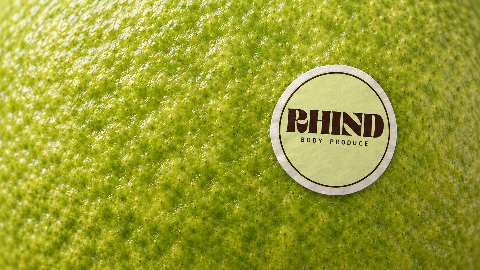 RHIND Body Produce wordmark on a produce sticker, on lime skin